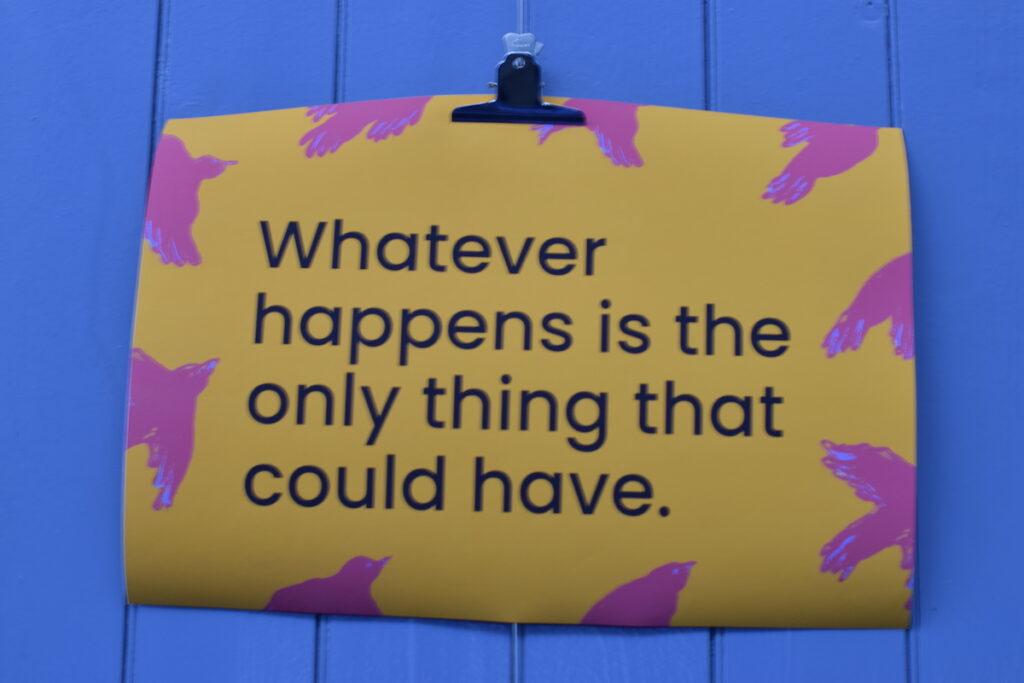 a photo of the words whatever happens is the only thing that could have, printed on a large piece of colourful paper